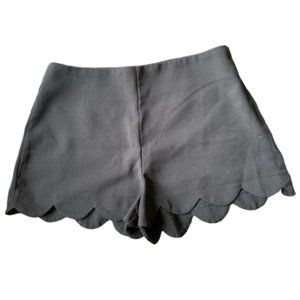 Black scallop-edged shorts